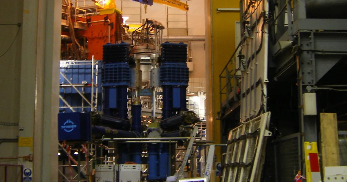 The JET tokamak building at the Culham Centre for Fusion Energy, Oxfordshire, seen through an adjacent doorway.