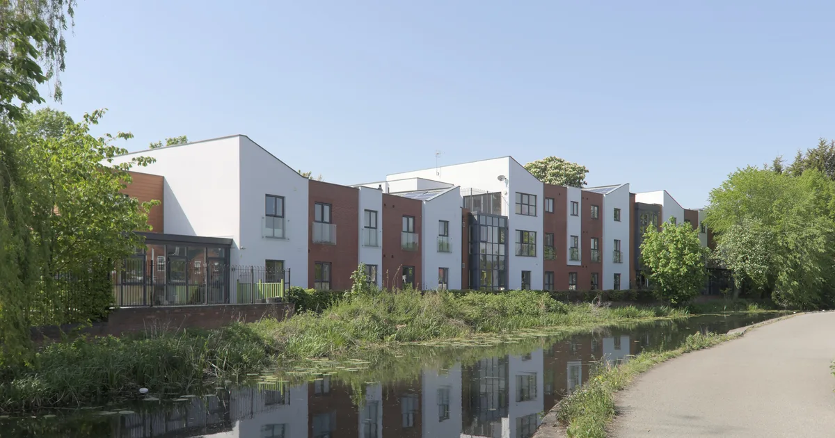 Canal Vue, a modern care home in Ilkeston, Derbyshire, seen across a canal.