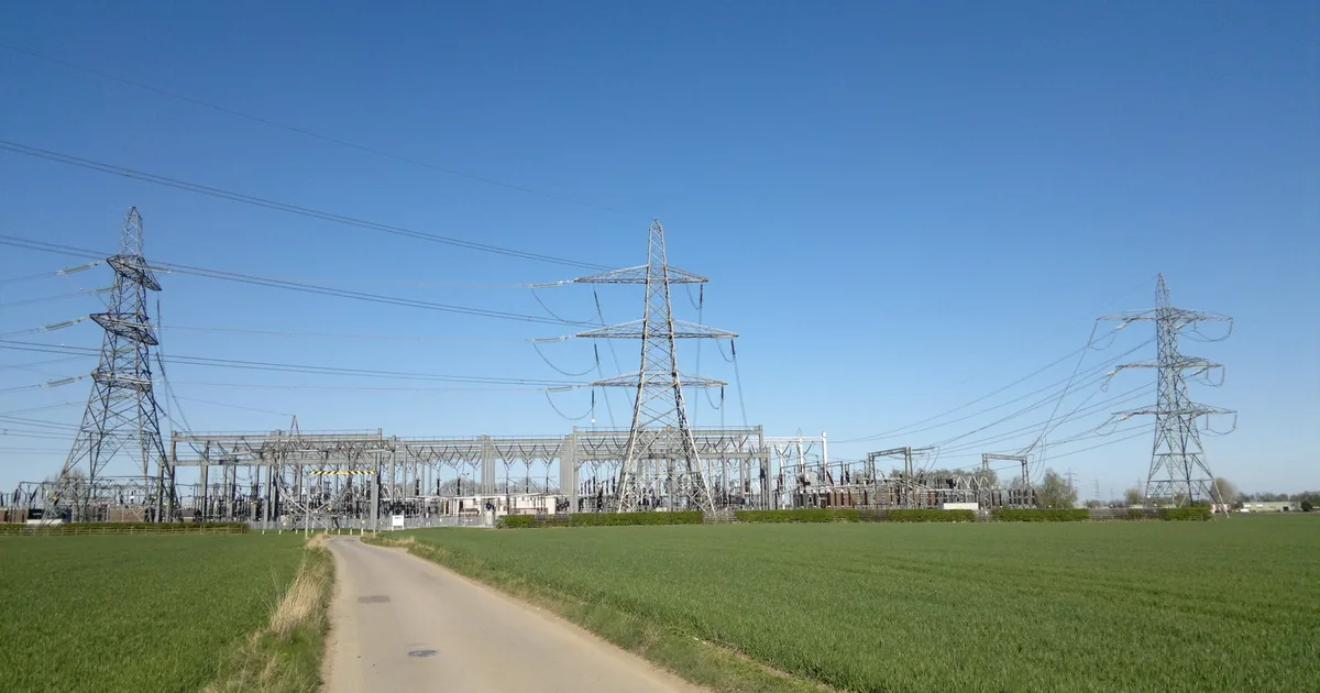 A National Grid electricity substation near Skidby, East Riding of Yorkshire, with transformers and overhead lines against an open sky.