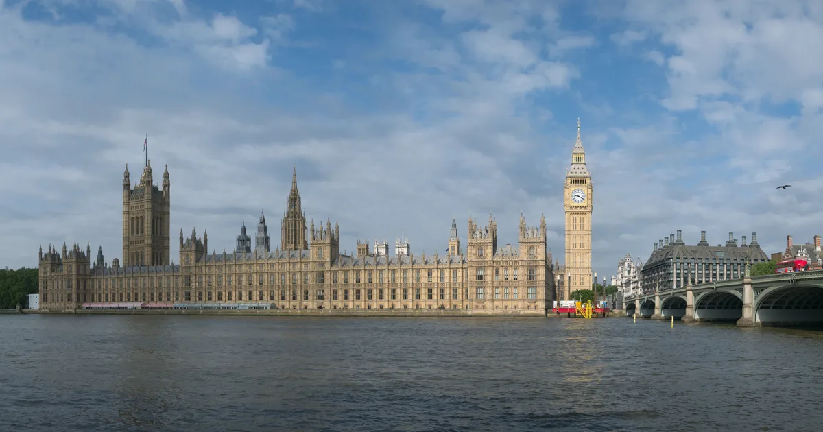 The Palace of Westminster and Elizabeth Tower, seen across the River Thames, London.