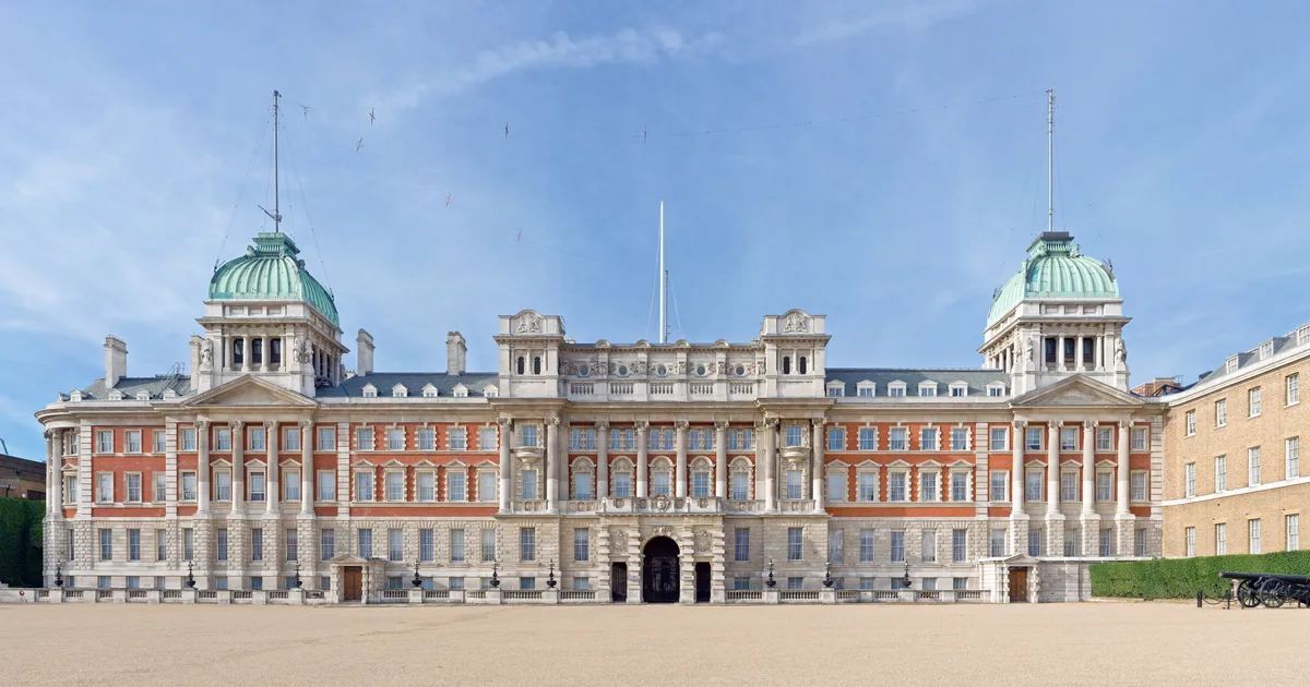 The Admiralty Extension building on Whitehall, London, seen from Horse Guards Parade, a stone government building with columns and statuary.