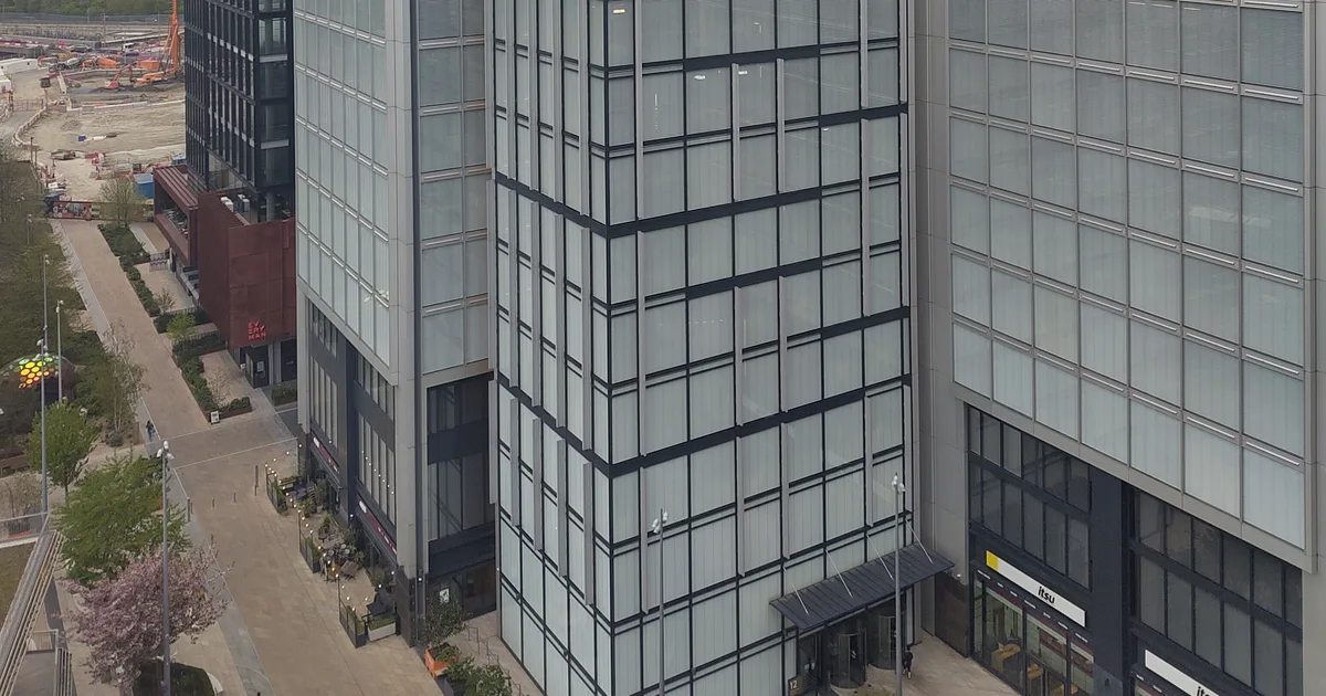 12 Endeavour Square, the Financial Conduct Authority's headquarters in Stratford, London, seen from above among neighbouring office towers.