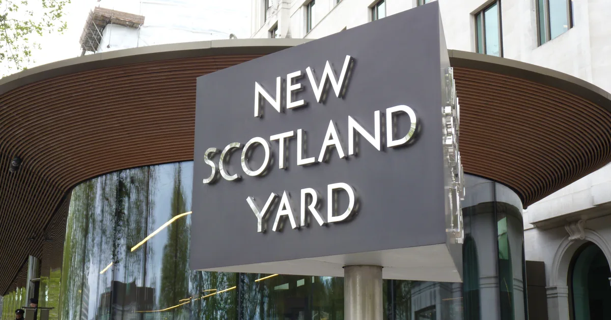 The New Scotland Yard revolving sign outside the Metropolitan Police's headquarters on the Victoria Embankment, London.