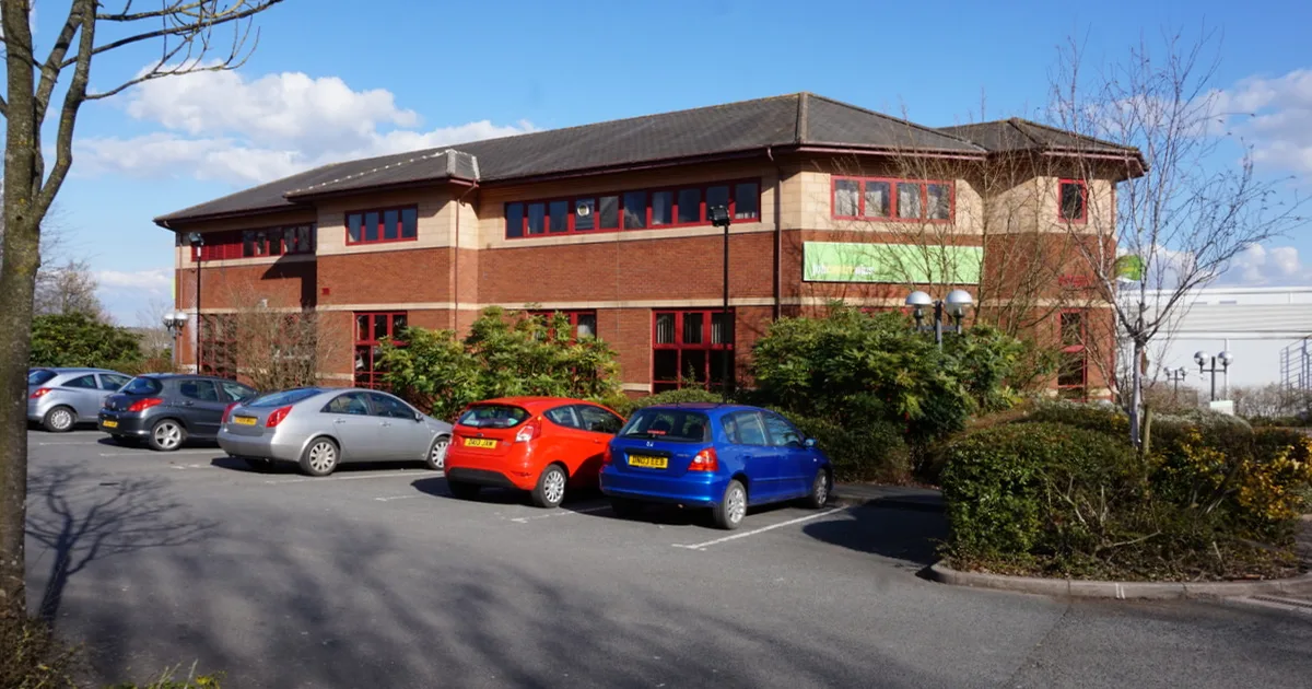 Telford Jobcentre Plus building, a modern low-rise office block with a car park in front.