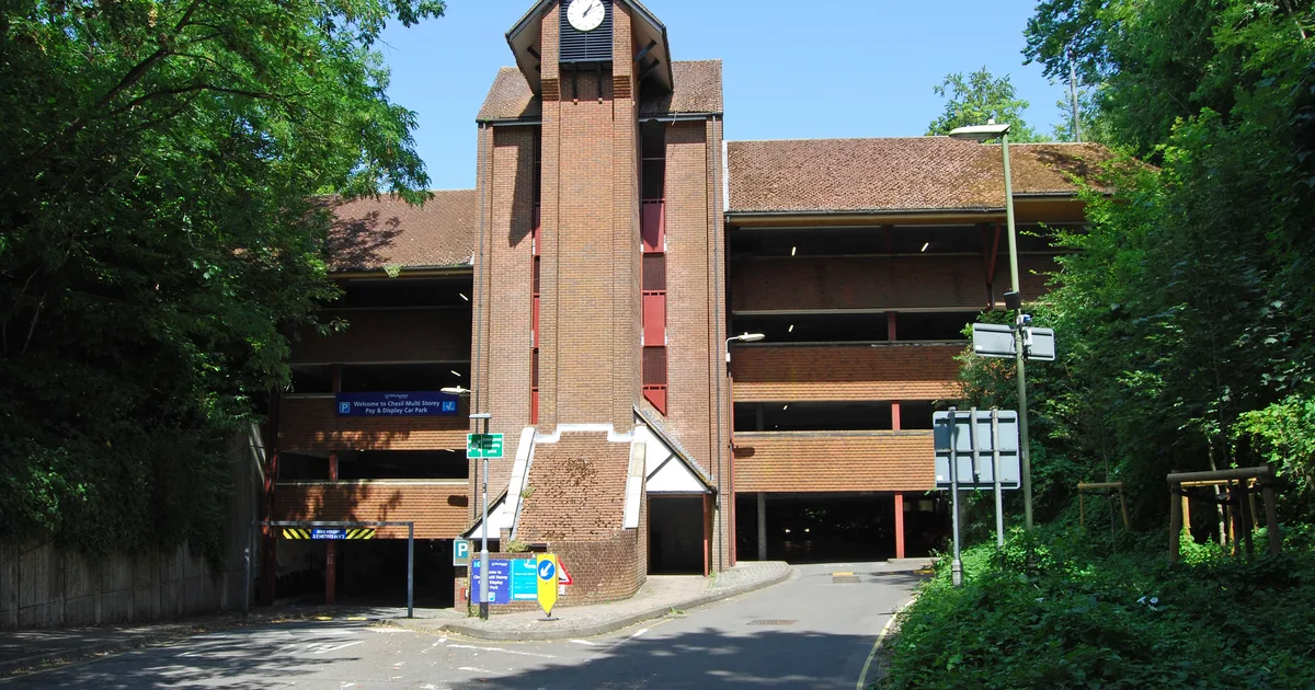 A multi-storey car park with a central clock tower, Winchester.