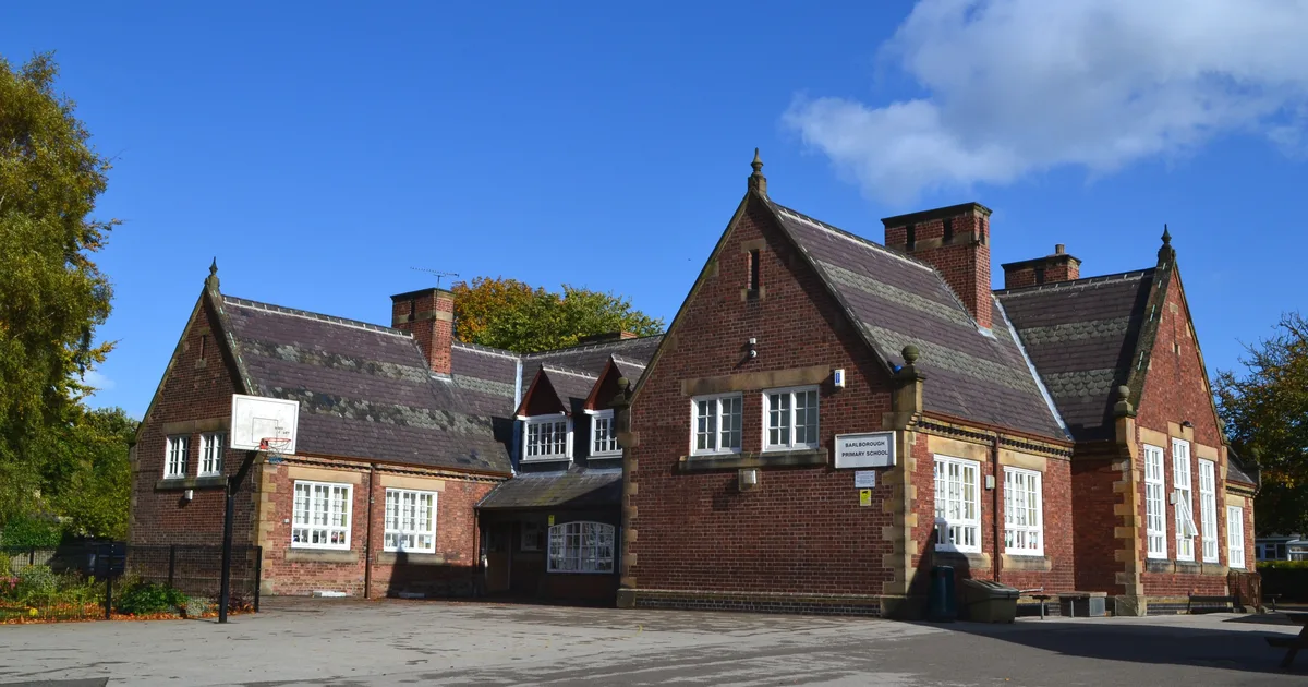 Barlborough Primary School, a stone-built listed school building in Derbyshire, photographed from the playground.