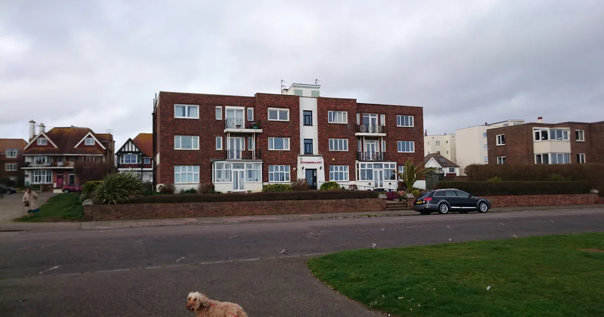 Strathmore Court, a three-storey brick block of flats on the seafront at Bexhill-on-Sea, East Sussex.